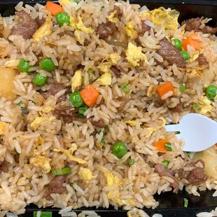 a plate of rice and vegetables