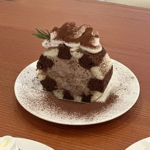 Midnight Classic chocolate cake layered with a soft chocolate sheet and subtly sweetened chocolate cream.