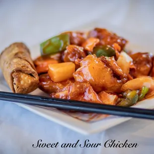 a plate of food with chopsticks
