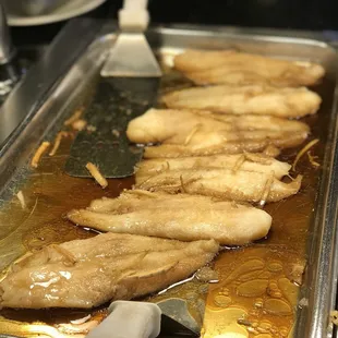 a pan of fried fish
