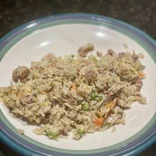 Three Pork Fried Rice $13 - ham, bacon and pork w/ veggies.  Wanted to show the plated version. Loved the cabbage in it!