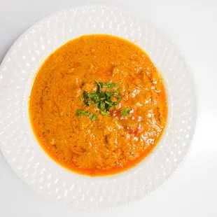 BUTTER CHICKEN A sweet creamy tomato and fenugreek-based sauce.