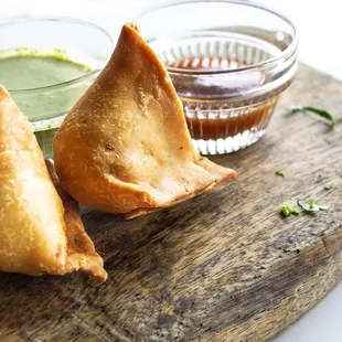 SAMOSA  Fried pastry stuffed with potatoes and spices.