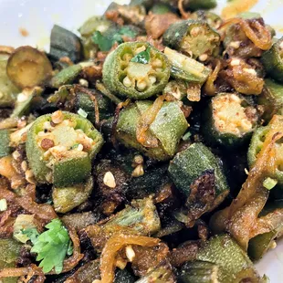 BHINDI MASALA Okra cooked with onion and spices.