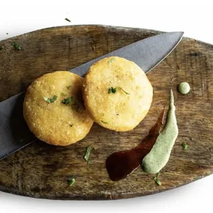 VEGETABLE KABAB Mashed potatoes patties mixed with peas, coriander, spices and deep fried.