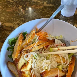 a plate of food with chopsticks
