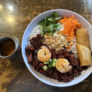 #54 Charbroiled pork, shrimp, &amp; crispy spring roll in a rice noodle bowl. So delicious