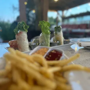 Garlic fries and spring rolls on the patio.