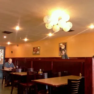 a person sitting at a table in a restaurant