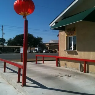 a red lantern on a pole