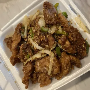 beef and onions in a styrofoam container