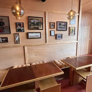 a restaurant with wooden tables and benches