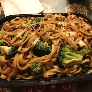 a bowl of noodles and broccoli