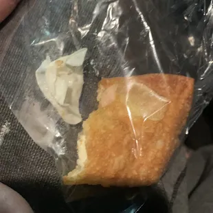 CRAB RANGOON WITH A PEICE OF A GLOVE INSIDE IT