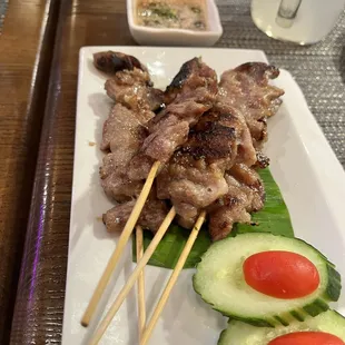 skewered meat and vegetables on a plate