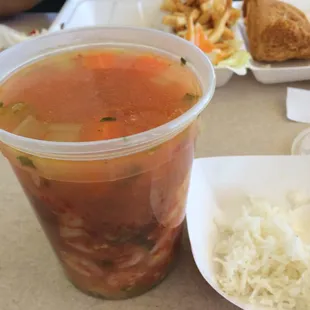 Seafood soup with white rice. Then 2 crispy fish filets with salad &amp; French fries!