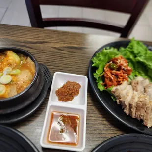 Pork with lettuce wrap. The menu item is Napa with pork. Ssamjang, dipping sauce, radish kimchi. Tofu stew.