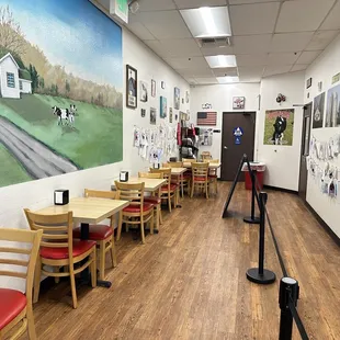 a dining area with tables and chairs