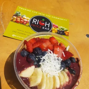 a bowl of fruit and coconut