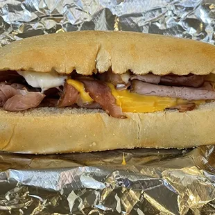 Hot ham and cheese sub with mayo.