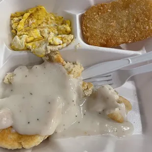 Scrambled eggs, hash brown, biscuit with gravy.