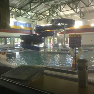 Indoor water park with walking lane, zero entry, and slides.