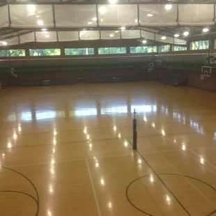 Open gym with walking track above it.