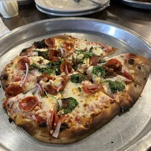 Pepperoni, basil, garlic, red onion pizza