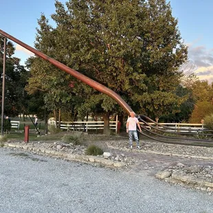 The worlds largest pitch fork next to the restaurant