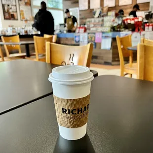 a cup of coffee on a table