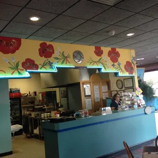 Front counter with flowers.
