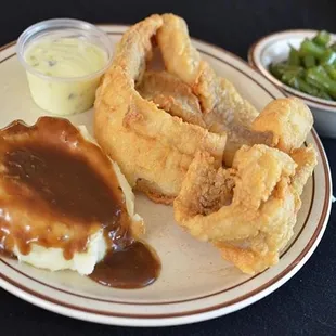  plate of fried fish, mashed potatoes, and gravy