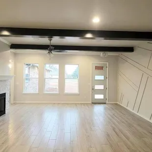 empty living room with wood floors