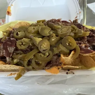 Loaded pulled pork nachos with sour cream on the side (reg size), so yummy!