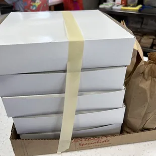 a stack of pizza boxes