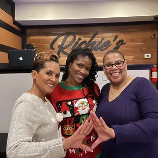 three women posing for a picture