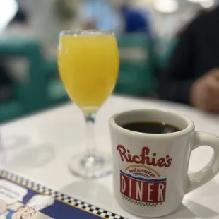 a cup of coffee and a glass of orange juice