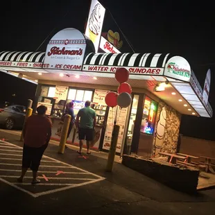 people walking out of the building