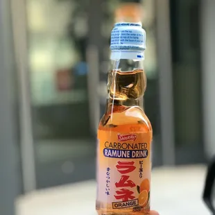 a bottle of orange drink