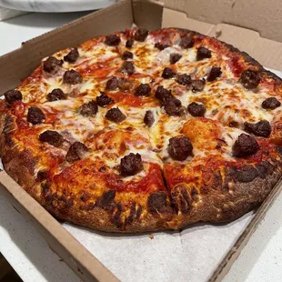 Medium 12" Cheese Pizza with thick crust, sausages, and Canadian bacon