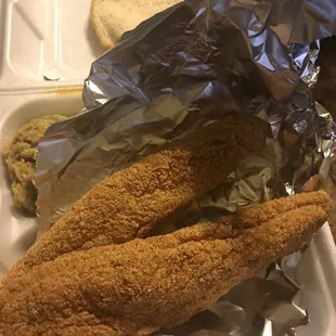 a tray of fried fish and bread