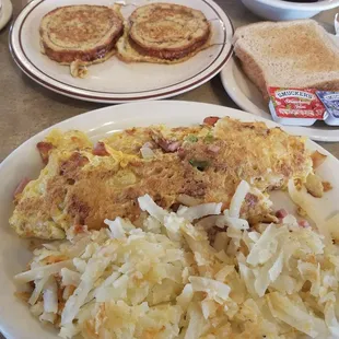 Tons of hash browns, omelette, and delicious cinnamon french toast.