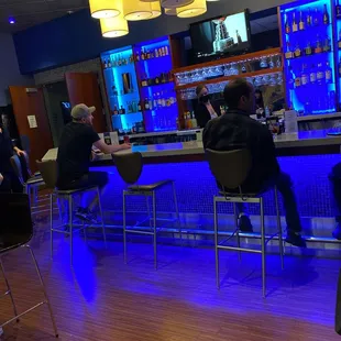 people sitting at a bar