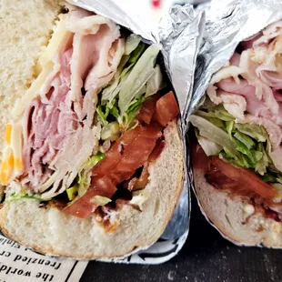 a sandwich wrapped in aluminum foil