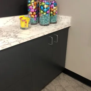 a counter with candy and candy balls