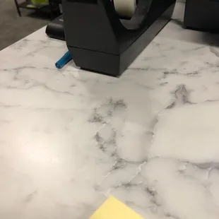 a tape dispenser on a counter