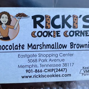 a woman holding a tray of cookies