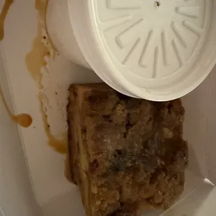 Peach cobbler bread pudding with vanilla ice cream.