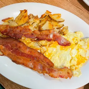 bacon, eggs, and potatoes on a plate