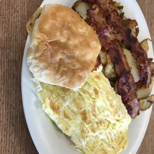 Eggs, biscuit, bacon and home fries